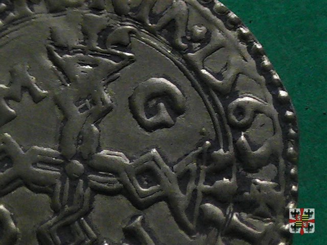 Scudo d'oro con croce filettata e stemma partito 1565